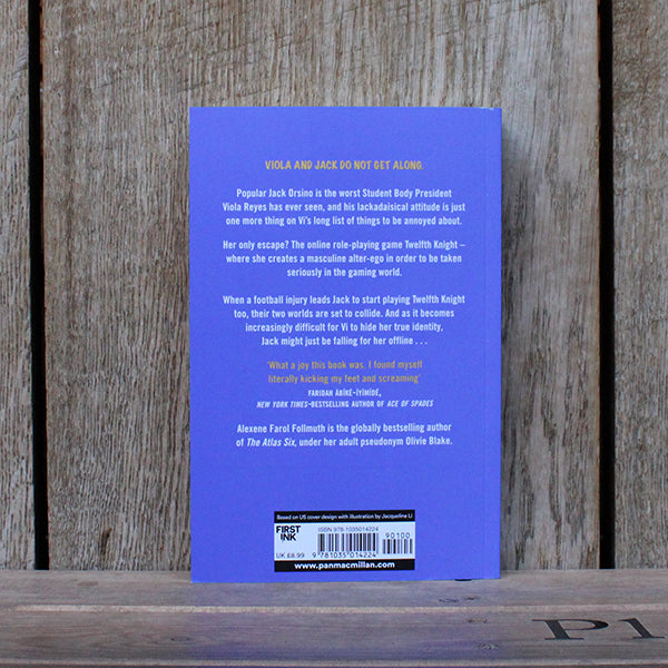 
                  
                    Pale purple paperback book with gold and white text
                  
                
