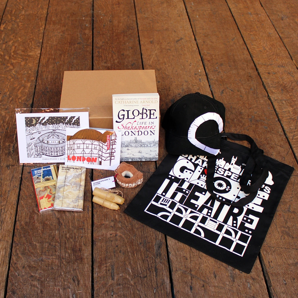 Kraft gift box open with a selection of exclusive Shakespeare's Globe gifts.