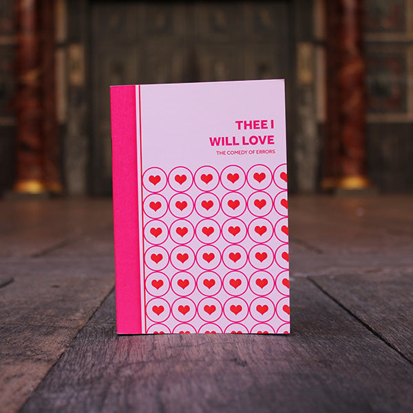 
                  
                    Paperback small notebook in pinks, reds, and white, with graphic text and hearts
                  
                