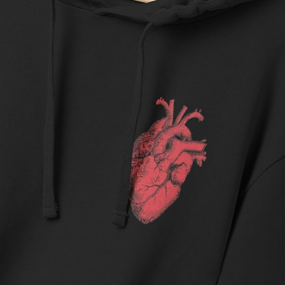 Black hoodie back with small red anatomical heart graphic on upper left chest