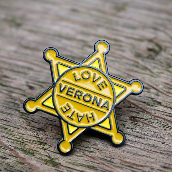 Yellow sheriffs badge with black outline and black text