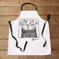 White apron with a cat illustration and text on a wooden surface