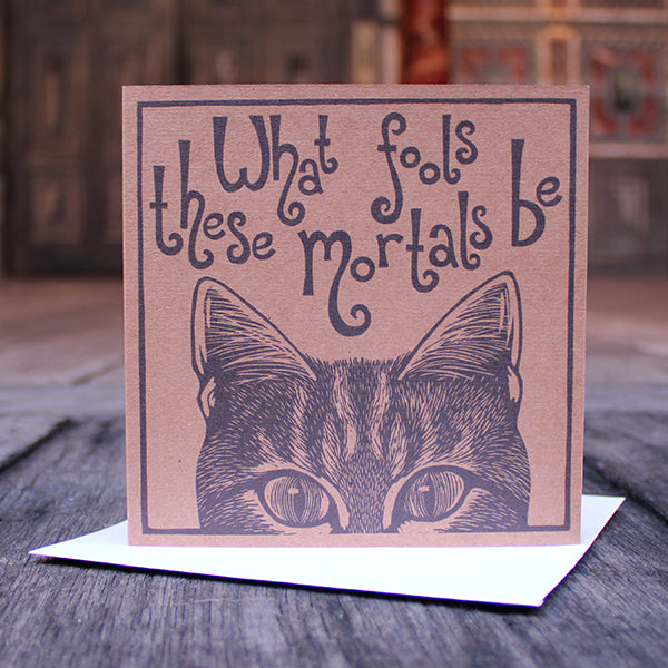 Recycled brown card greeting card with black print of cat from eyes up and text above
