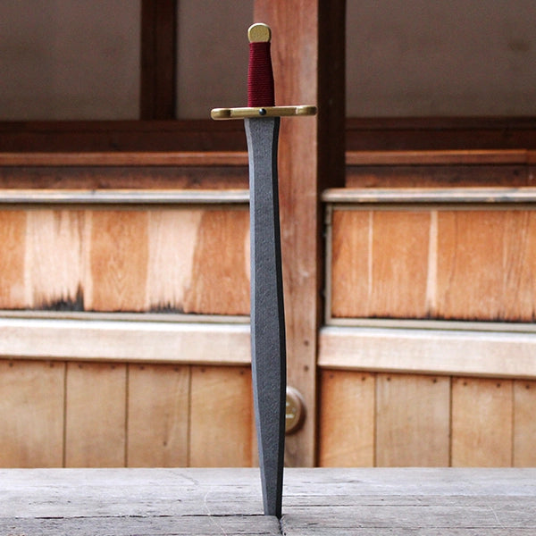 Silver blade wooden sword with gold handle wrapped in maroon string