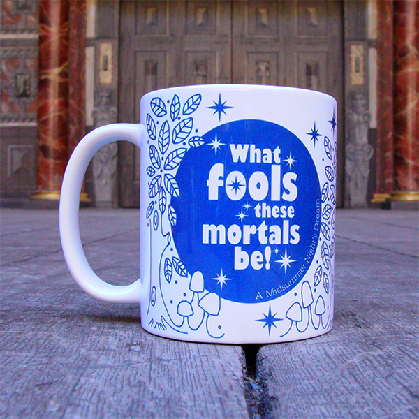 White earthenware coffee mug with a design printed in blue. The design consists of a solid blue circle representing the full moon, surrounded by hand-drawn leaves and mushrooms, to imitate a forest. In the centre of the moon is a quote from Shakespeare play, A Midsummer Night's Dream printed in white. The quote is surrounded by white stars