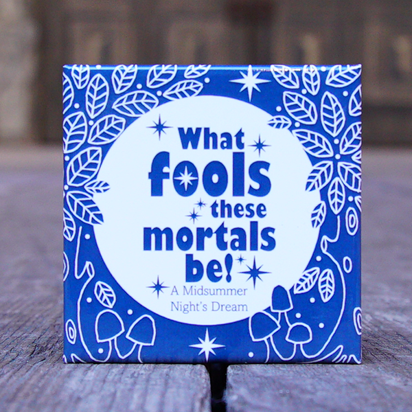 Blue square magnet with white circle and blue quote text in centre and white leaves around edges