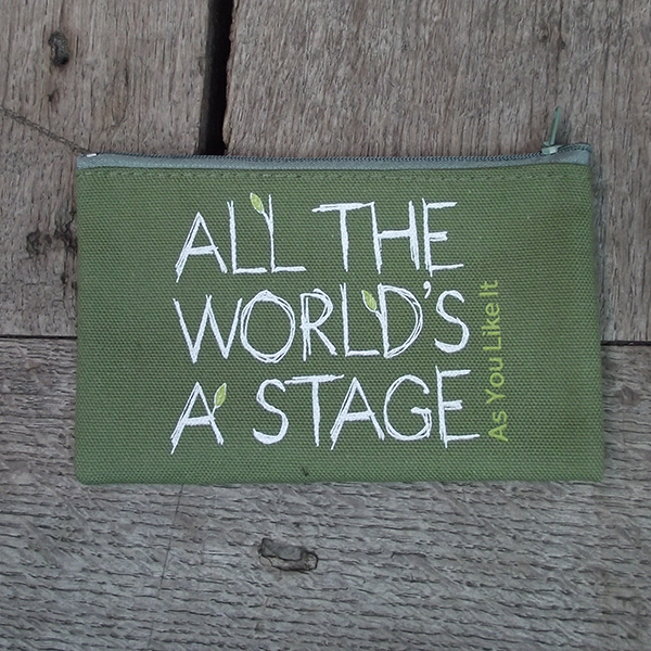 Sage green cotton zipped purse with a quote from Shakespeare play, As You Like It (all the world's a stage) printed in white. The lettering is hand-drawn in a scribbled style and several of the letters have little lime green leaves 'growing' from them. The title of the play is printed in lime green up the right hand side of the quote.