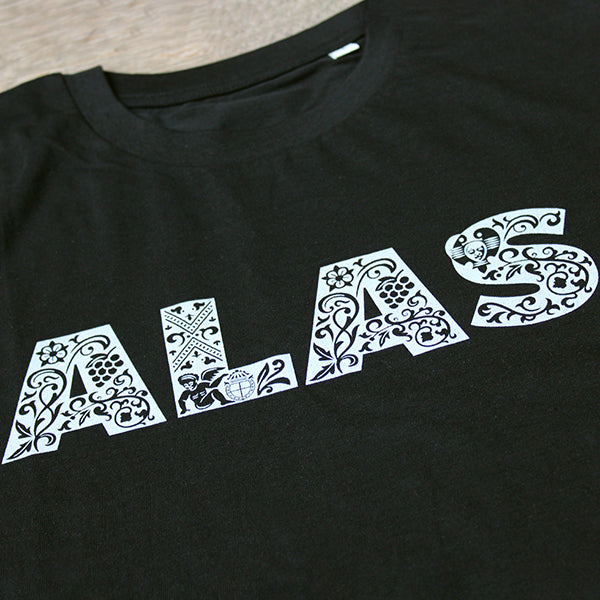 
                  
                    Black tshirt with white graphic text depicting ALAS across the chest
                  
                