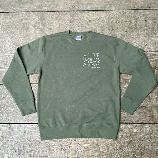 Sage green cotton sweatshirt with 'All The World's a Stage' quote on left breast.