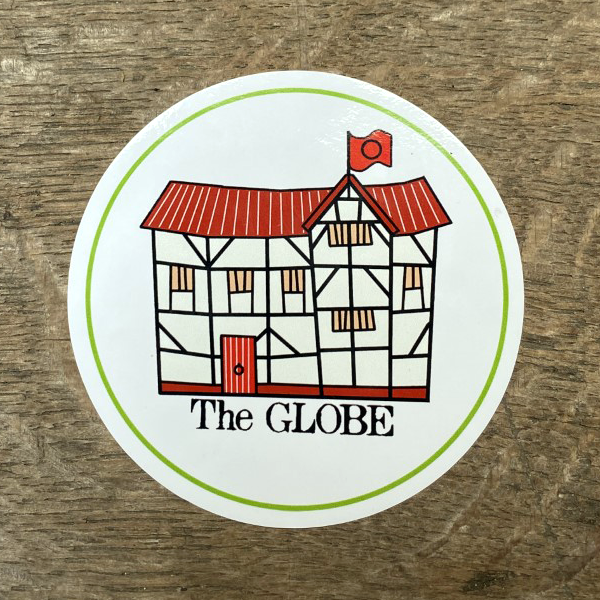 Circular white sticker with red cartoon style drawing of the Globe 