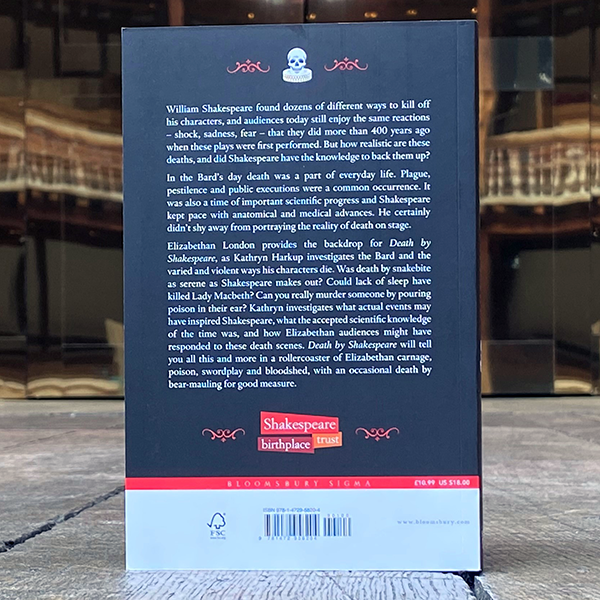 Black paperback book with white text and red graphic below