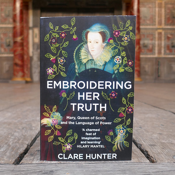 Paperback copy of Embroidering her Truth: Mary, Queen of Scots and the Language of Power by Clare Hunter