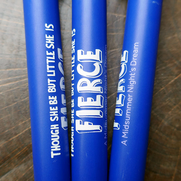 
                  
                    Mid-blue bioplastic ballpoint pen printed on the barrel with a quote from Shakespeare play, A Midsummer Night's Dream, "though she be but little she is fierce" in white hand-drawn lettering.
                  
                
