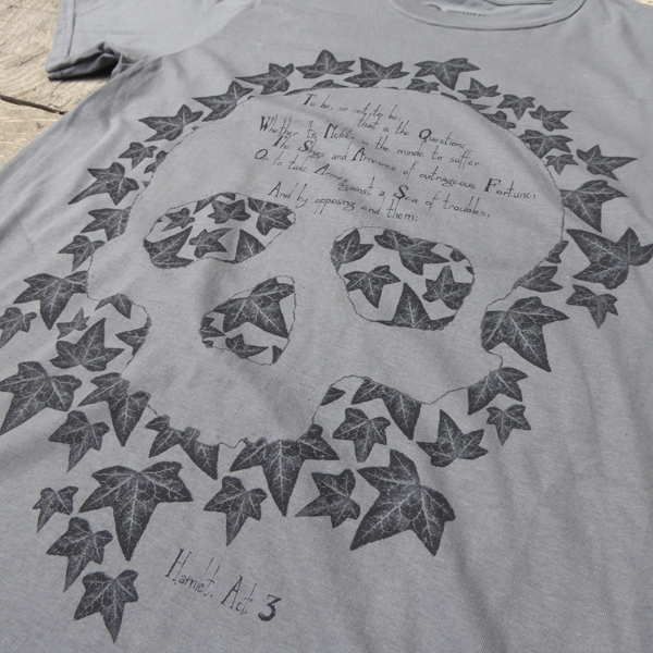 
                  
                    Grey cotton t-shirt with leafy skull design and Hamlet quote across centre front
                  
                