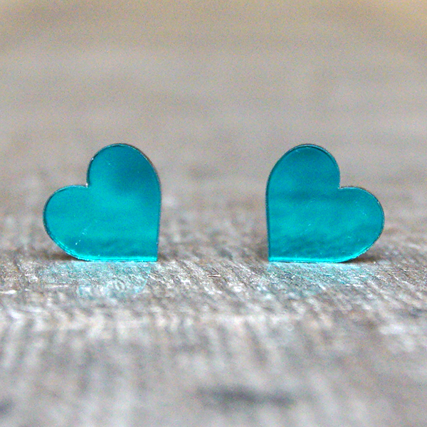 
                  
                    Heart shaped stud earrings made from teal, mirrored acrylic.
                  
                
