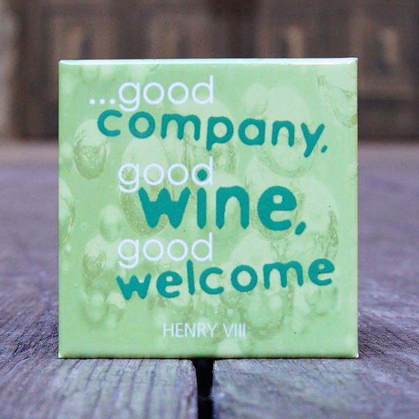 Square fridge magnet with a background image of bubbles in white wine. Over the top of this is a quote from Shakespeare play, Henry VIII, "...good company, god wine, good welcome" printed in white and green