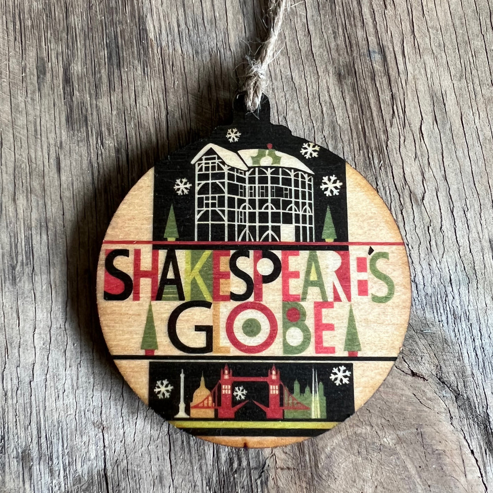 Round wooden decoration with a natural string hanger. The decoration is printed with a black and white image of the Globe Theatre with colourful lettering underneath which reads 'Shakespeare's Globe'