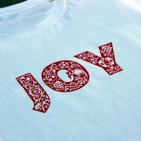 
                  
                    Plain white unisex tshirt with bold red text across the chest depicting JOY
                  
                