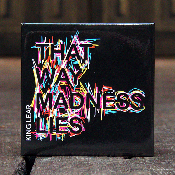 Black square fridge magnet with a quote from Shakespeare play, King Lear, "that way madness lies." The quote is made of black capital letters which are picked out by a mess of spiky lines in white, yellow, red, pink and electric blue behind them.