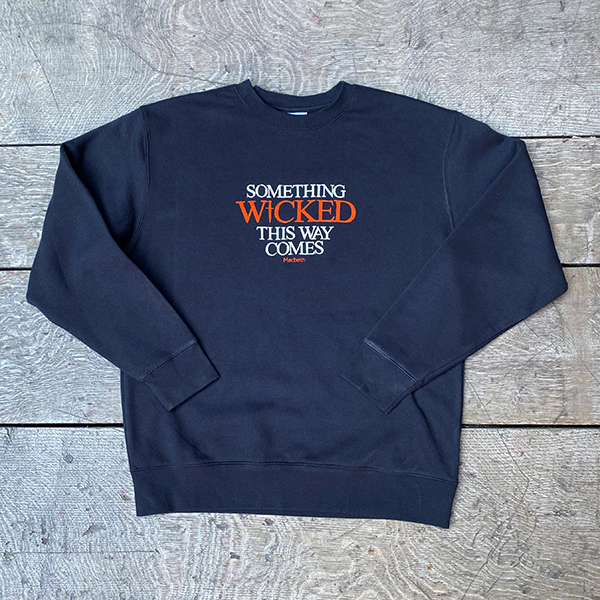 
                  
                    Black cotton sweatshirt with white graphic font across the centre front and 'Wicked' text in orange
                  
                