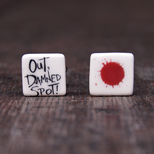 Ceramic cufflinks featuring a quote from Lady Macbeth on one (Out, damned spot!) and a blood spot on the other