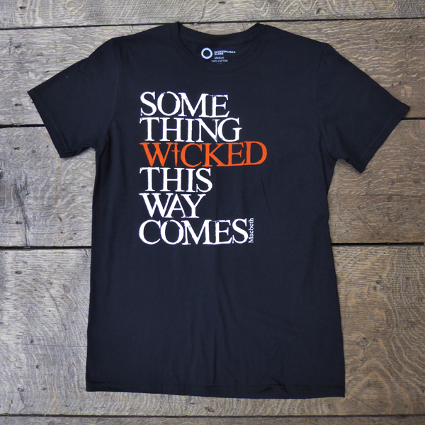 
                  
                    Black cotton crew neck, short sleeve t-shirt with a quote from Shakespeare play, Macbeth printed on the chest. The quote is printed in white, slightly distressed capital letters with the word 'wicked' printed in bright orange. 
                  
                