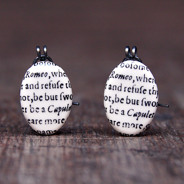 Oval ceramic earrings featuring a snippet from Juliet's balcony speech in Romeo and Juliet
