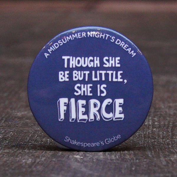 38 mm diametre mid blue button badge with a quote from Shakespeare play, A Midsummer Night's Dream, "though she be but little, she is fierce" printed in white, hand-drawn, capital letters