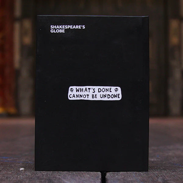Reverse of a black hardback journal celebrating Macbeth. The journal is printed centrally with a quote from the play, "what's done cannot be undone" in white