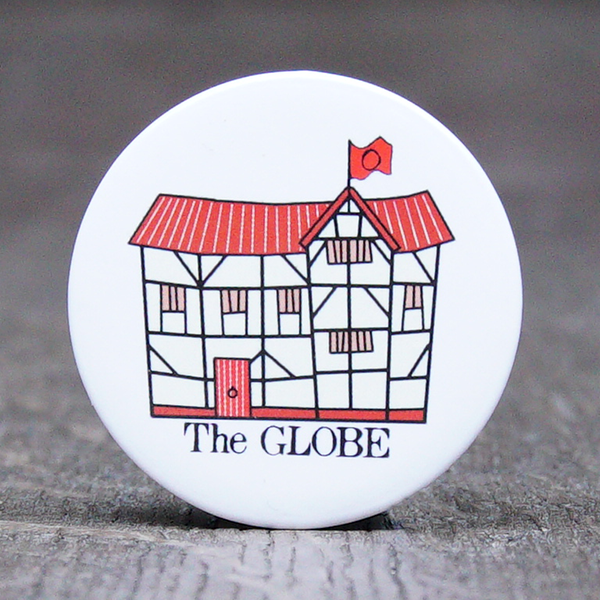 38mm round button badge with a cartoon image of the Globe Theatre printed on a white background. The cartoon Globe has a black frame, and a red roof, door and flag. The words 'The GLOBE' are printed beneath the image in black
