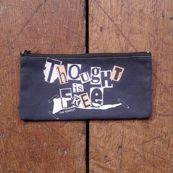 Black rectangular cotton pencil case with a black zip. On the body of the case is printed a quote from Shakespeare play, The Tempest, "thought is free". The letters look as though they are made from letters torn from newspapers, they are arranged in a punk fashion with safety pin holding them.