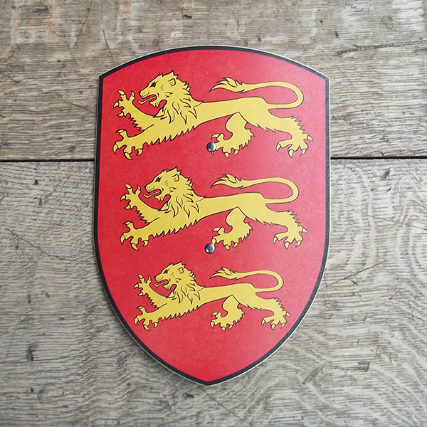 Toy shield made from beech wood. The shield is red and printed with three yellow heraldic lions.