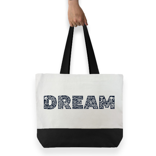 
                      
                        White cotton tote bag with black handles and black base featuring large black graphic text across the front DREAM
                      
                    