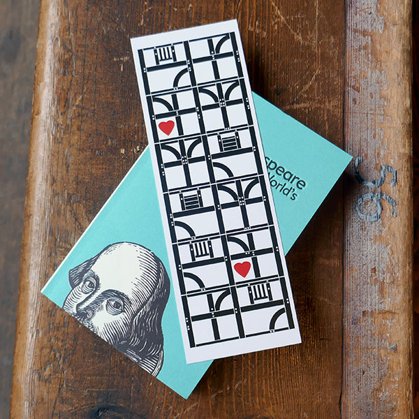 Large card bookmark with a white background, printed in black with representations of the architectural panels that make up the Globe Theatre's wooden frame. A bright red graphic heart sits inside two of the frames., Shown with a copy of 'This is Shakespeare' by Emma Smith